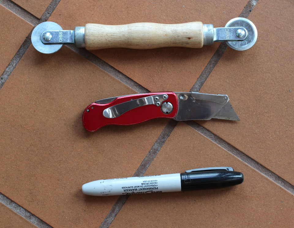 Fig.3 - FROM TOP: A spline tool for crimping folds in the corrugated polypropylene. NOTE: Do not press hard enough to cut the material when using the spline tool. A utility knife. A marker. You will also need a measuring tape.